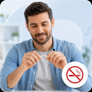 Person breaking a cigarette in half with a determined expression, symbolizing smoking cessation support.
